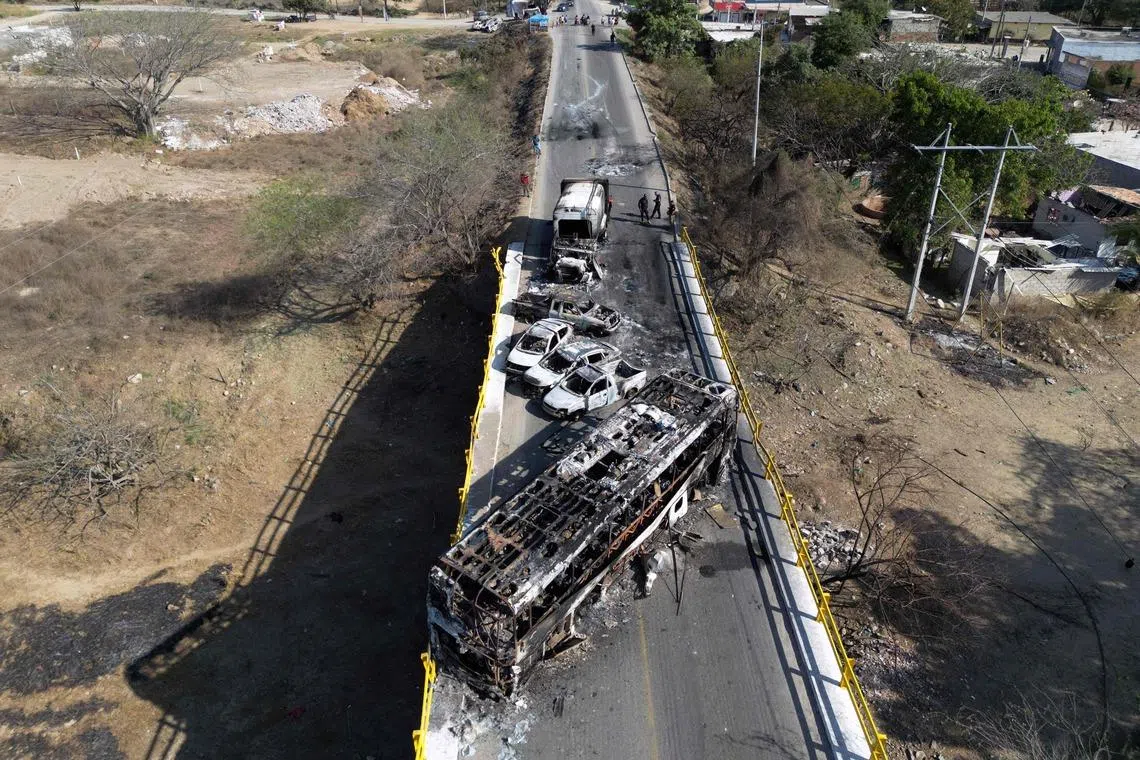 Burnt vehicles over the "La Desembocada" bridge in Puerto Vallarta, Jalisco State, Mexico, on Feb 24, 2026. 