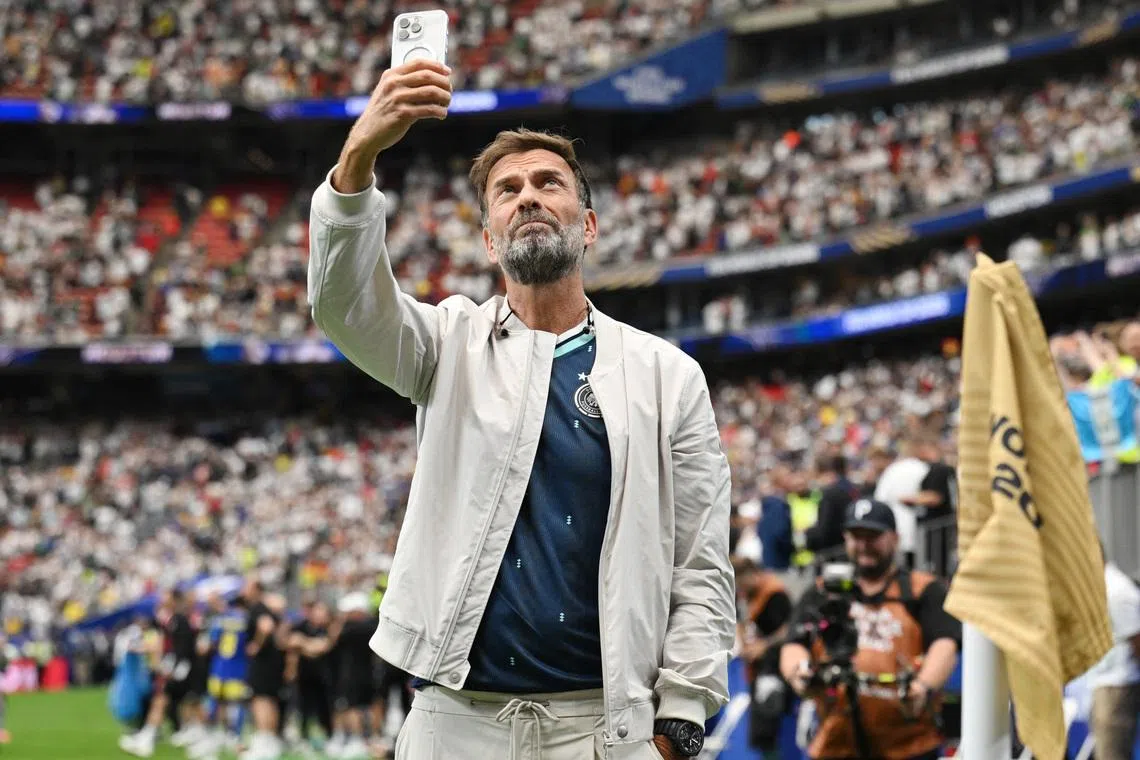 Soccer Football - FIFA World Cup 2026 - Group E - Germany v Curacao - Houston Stadium, Houston, Texas, U.S. - June 14, 2026 Red Bull's Global Head of Soccer Juergen Klopp takes a photograph inside the stadium after the match REUTERS/Annegret Hilse