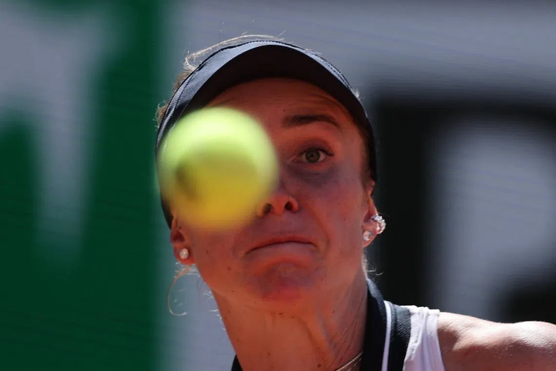 Svitolina huffs and puffs into French Open round two