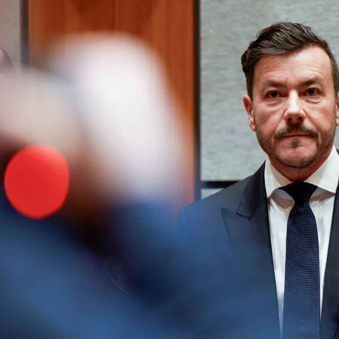 Austrian former property tycoon Rene Benko awaits the start of his second insolvency fraud trial in Innsbruck, Austria, December 10, 2025. REUTERS/Michaela Stache