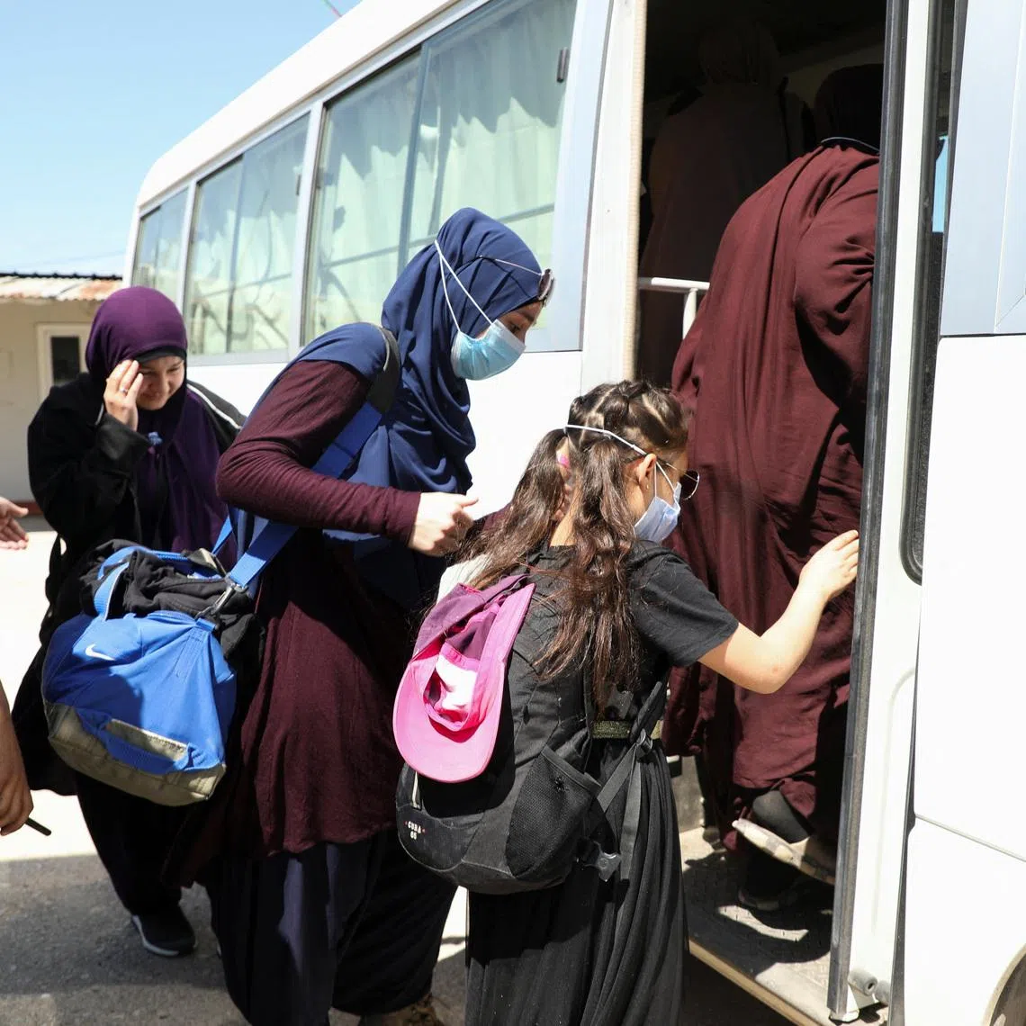 Members of Australian families believed to be linked to the Islamic State militants leave Roj camp near Derik, Syria April 24, 2026.