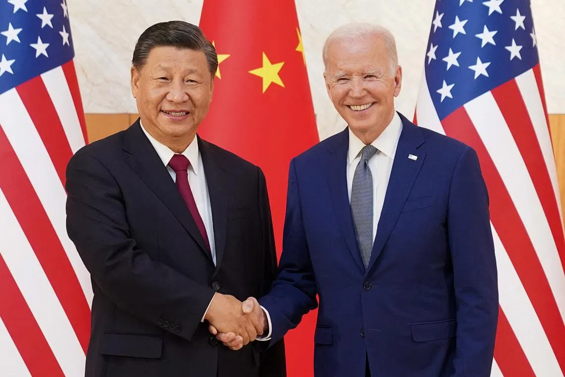 US President Joe Biden (right) with Chinese President Xi Jinping on the sidelines of the G20 leaders' summit in Bali on Nov 14, 2022.