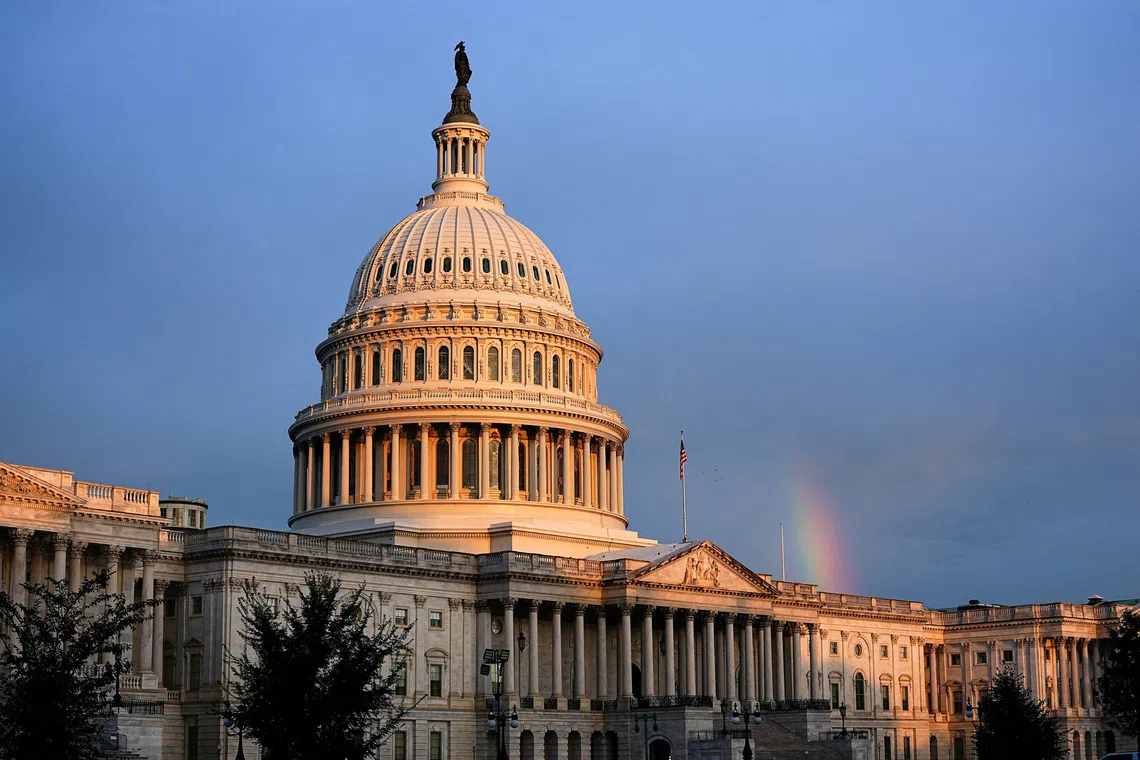 A rainbow is visible in the clouds behind the Capitol Building, weeks into the continuing U.S. government shutdown on Capitol Hill in Washington, D.C., U.S., October 18, 2025. REUTERS/Aaron Schwartz