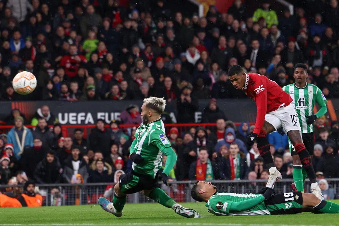 Manchester United' striker Marcus Rashford scoring the opening goal of the Europa League last-16 first leg game against Real Betis at Old Trafford stadium.