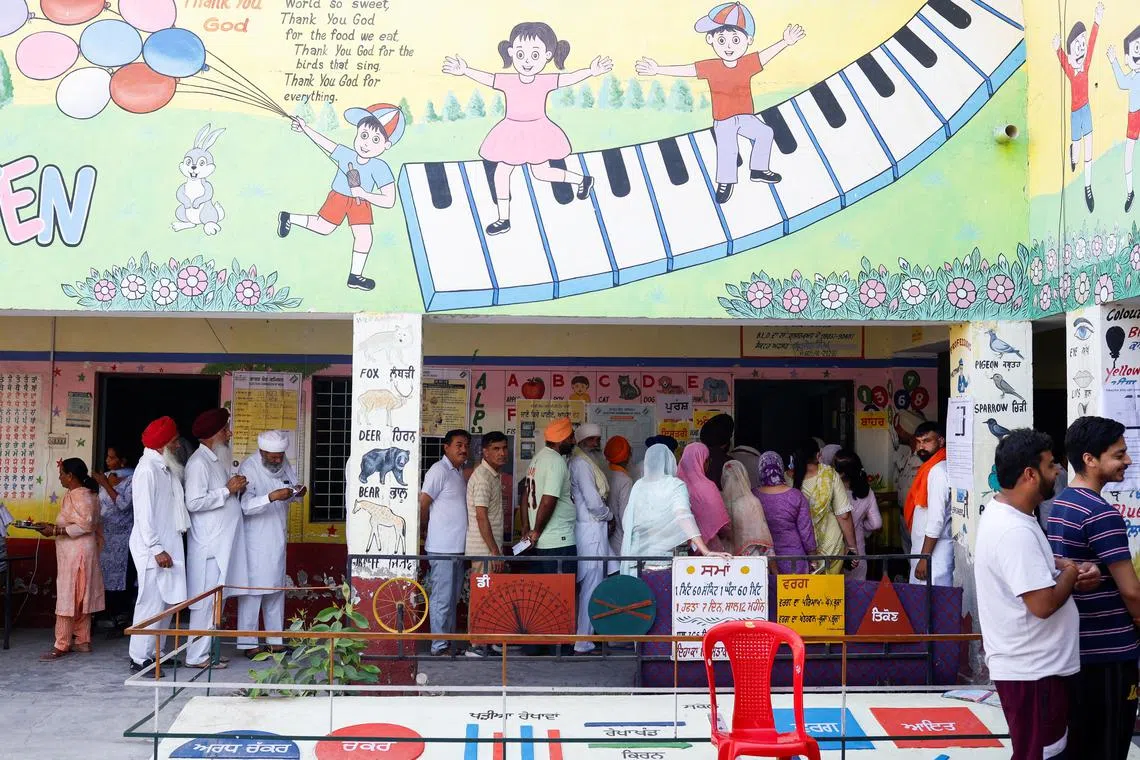 Voters stand in line to cast their votes at a polling station during the seventh and last phase of the general election, in Firozpur district, Punjab, India, June 1, 2024. REUTERS/Adnan Abidi