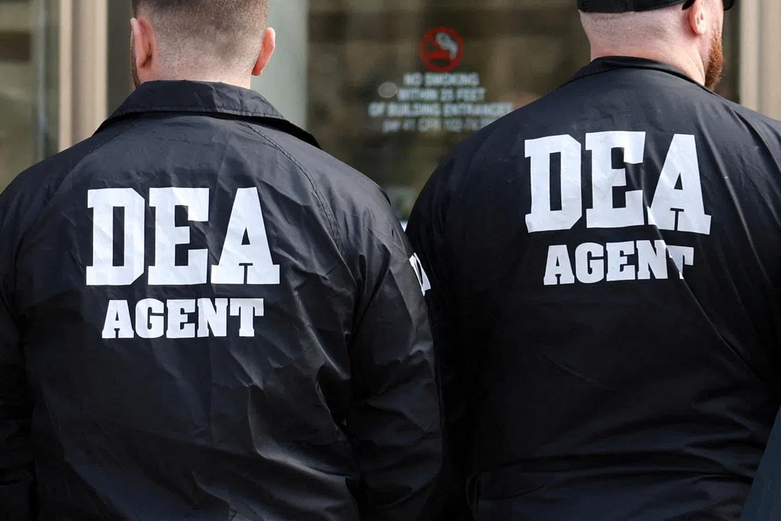 FILE PHOTO: Members of the Drug Enforcement Administration (DEA) stand outside the Brooklyn Federal Courthouse in Brooklyn, New York, U.S., March 26, 2025. REUTERS/Kylie Cooper/ File Photo
