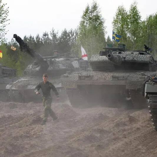 Soldiers with their battle tanks participating in the NATO Iron Spear exercise in Adazi training ground, Latvia, on May 18, 2026. 