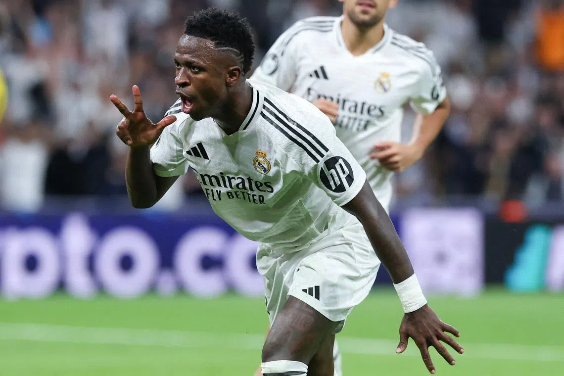 Real Madrid's Brazilian forward Vinicius Jr celebrating scoring a hat-trick and his team's fifth goal, during the match against Borussia Dortmund on Oct 22.