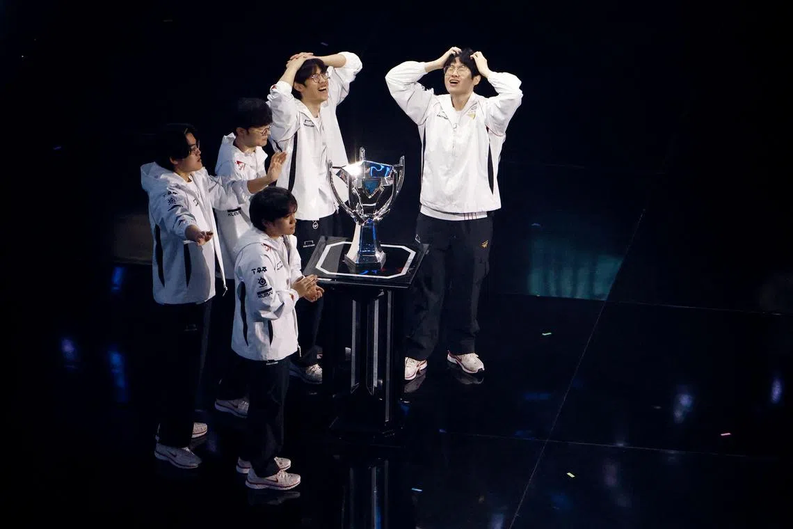 South Korea's T1 celebrate winning against China's Bilibili Gaming during the League of Legends World Championship final at the O2 Arena in London.