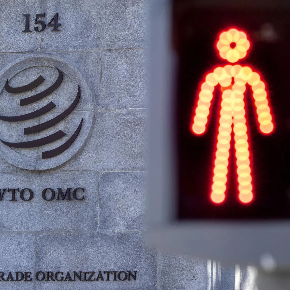 A logo is seen at the World Trade Organization (WTO) headquarters before a news conference in Geneva, Switzerland, October 5, 2022. REUTERS/Denis Balibouse
