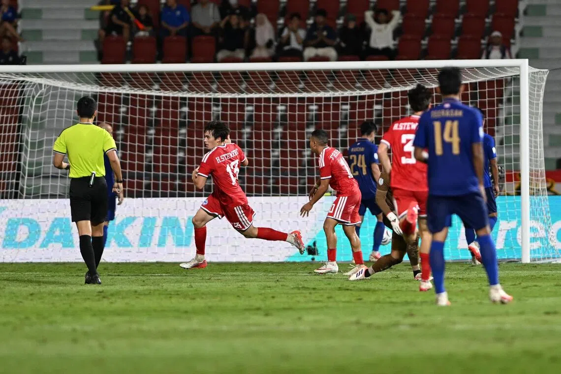 Singapore’s Harhys Stewart (No. 13) celebrating his goal against Thailand at the Rajamangala Stadium in Bangkok in the second leg of their ASEAN Championship semi-final clash on Aug 18.