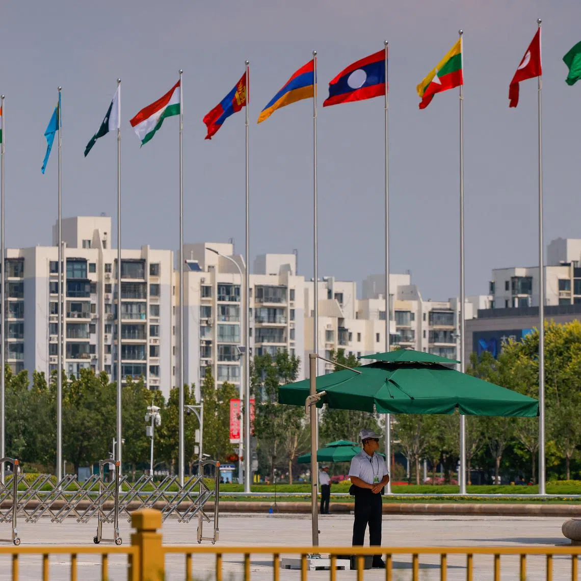 A security guard stands on duty next to the Meijiang Convention and Exhibition Centre, a venue for the Shanghai Cooperation Organisation summit in Tianjin on Aug 31.