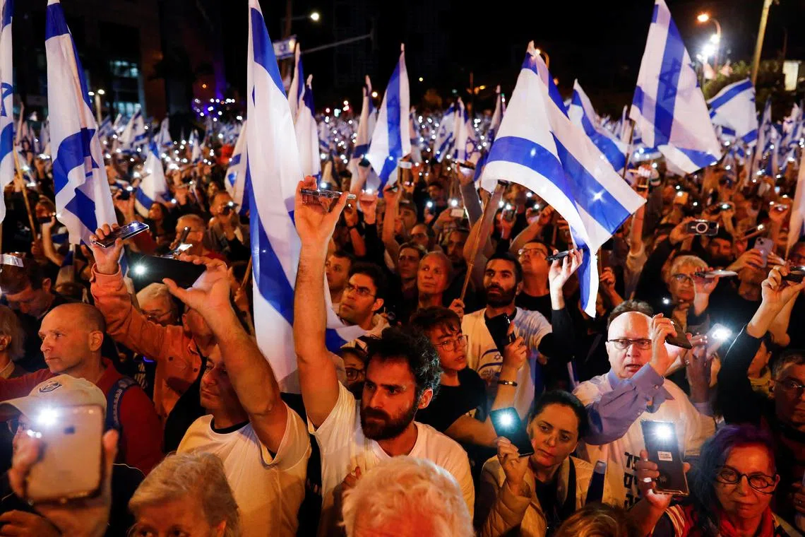 People demonstrate against Israeli Prime Minister Benjamin Netanyahu and his nationalist coalition government's judicial overhaul, in Tel Aviv.
