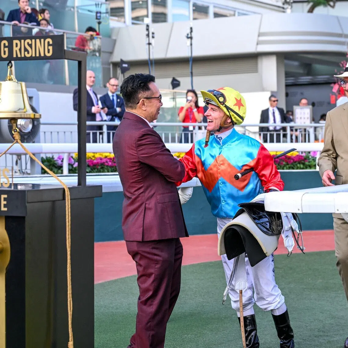 Zac Purton and David Hayes celebrating with owner Leung Shek Kong after Ka Ying Rising created history in Hong Kong racing at Sha Tin on Feb 22 as the record bell indicates - 18th win in a row, the longest winning streak since Silent Witness.
