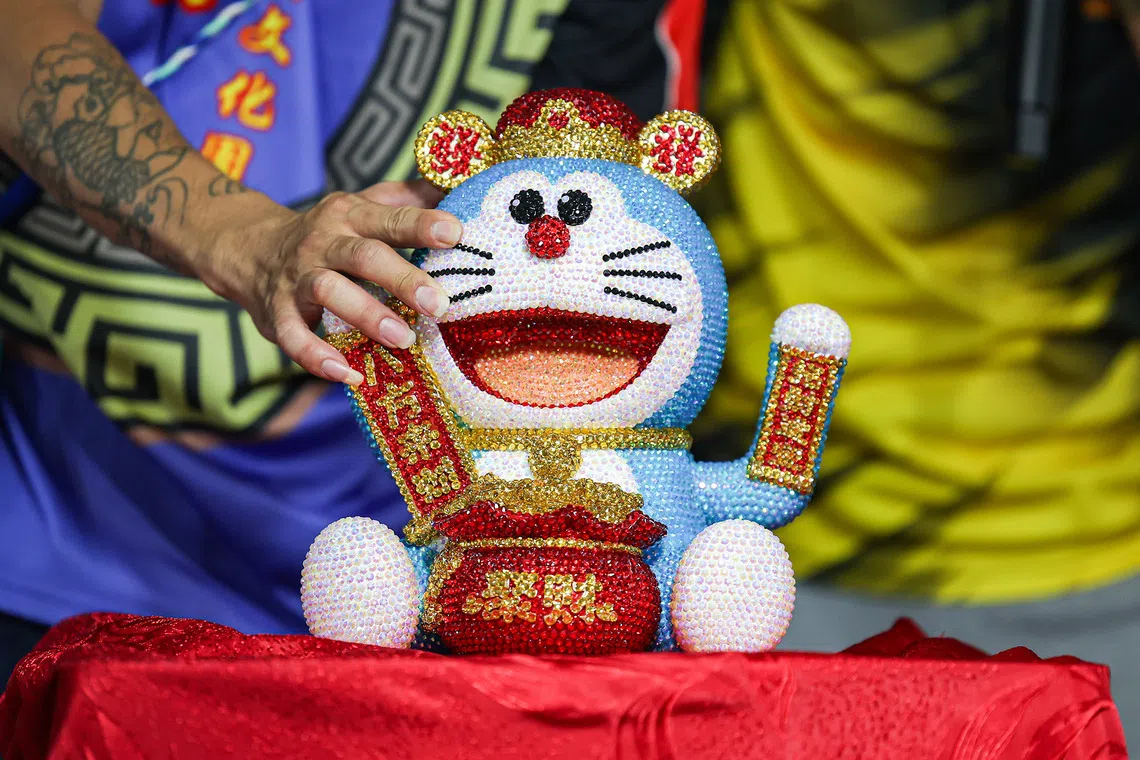 Close-up of an ornamental Doraemon being auctioned during the Hungry Ghost Festival dinner auction in Toa Payoh on Aug 23, 2026. ST PHOTO: BRIAN TEO