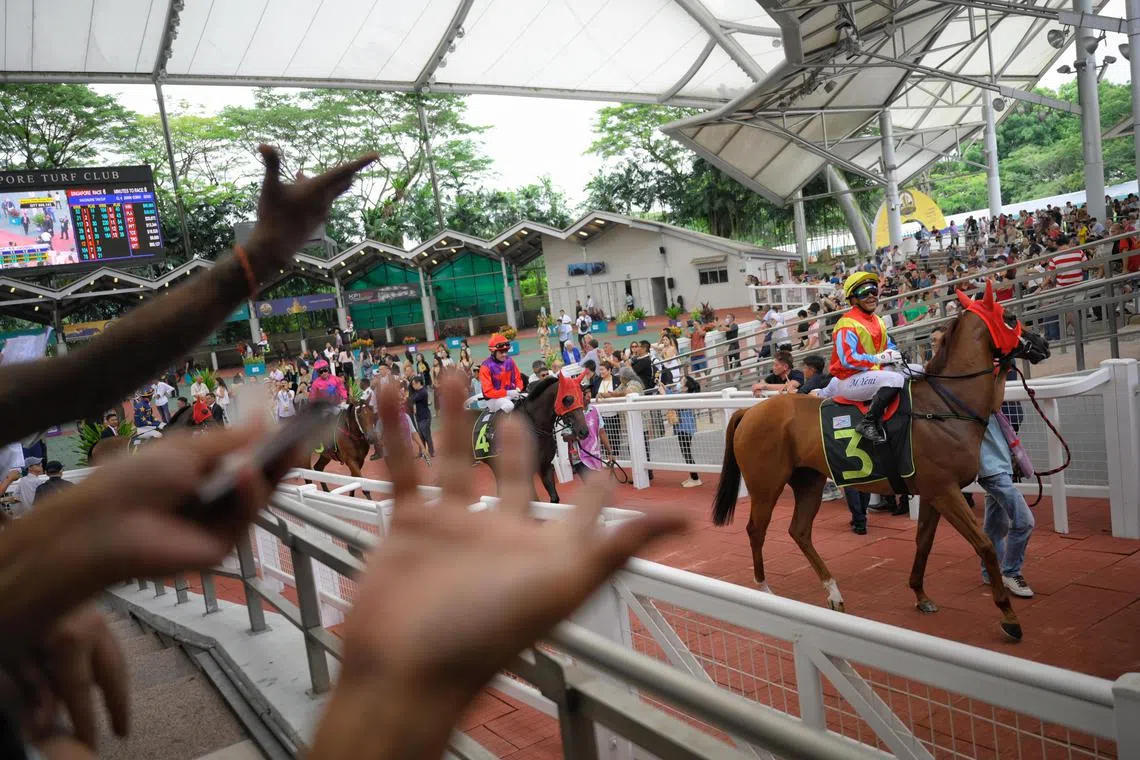 Jockeys exiting the parade ring ahead of their race at Singapore Turf Club on October 5, 2024.