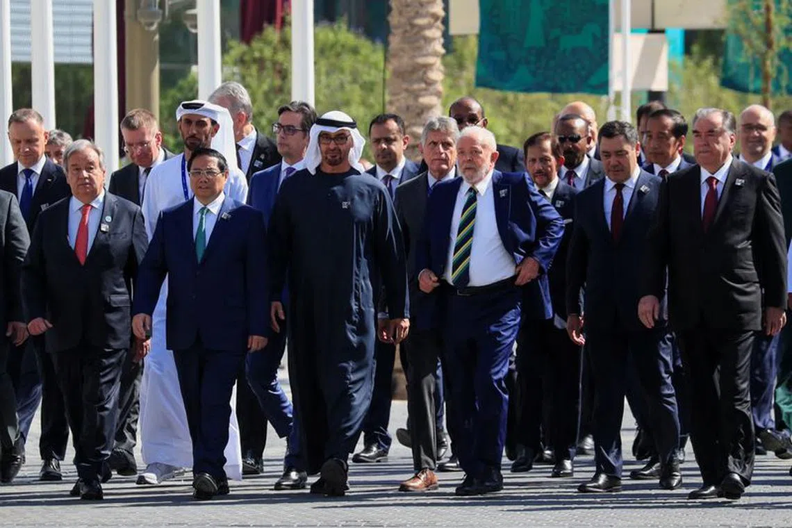 President of the UAE Sheikh Mohamed bin Zayed Al Nahyan walks alongside other world leaders and delegates at Dubai's Expo City ahead of the World Climate Action Summit during COP28 in Dubai on Dec 1, 2023. REUTERS/Thomas Mukoya