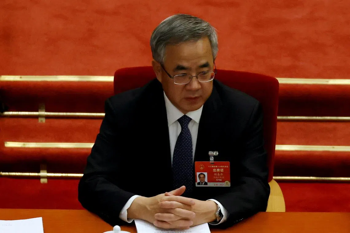 FILE PHOTO: Chinese Vice Premier Hu Chunhua attends the opening session of the National People's Congress (NPC) at the Great Hall of the People in Beijing, China March 5, 2021. REUTERS/Carlos Garcia Rawlins/File Photo NO RESALES. NO ARCHIVES