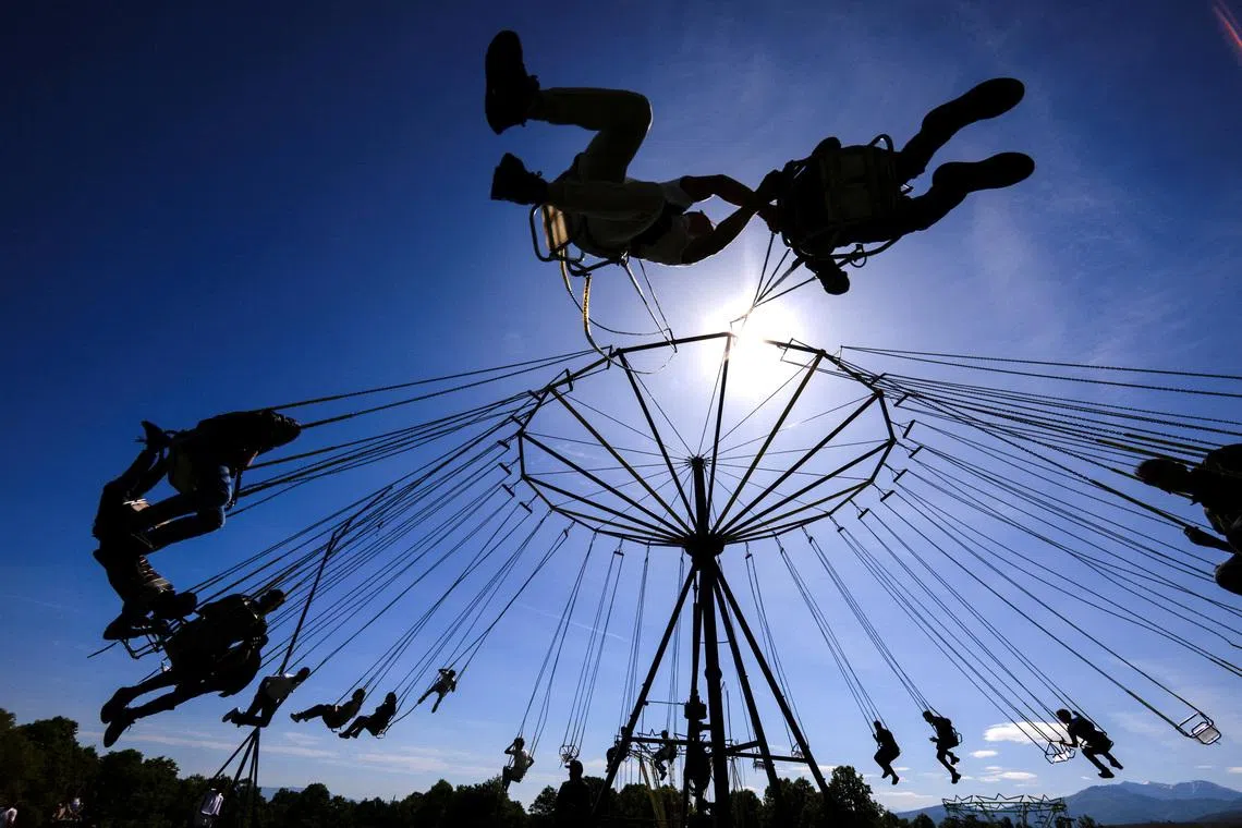 Ethnic Albanians taking a ride on a swing during a yearly ritual to celebrate St George's Day in the village of Babaj i Bokes, Kosovo, on May 6, 2026.