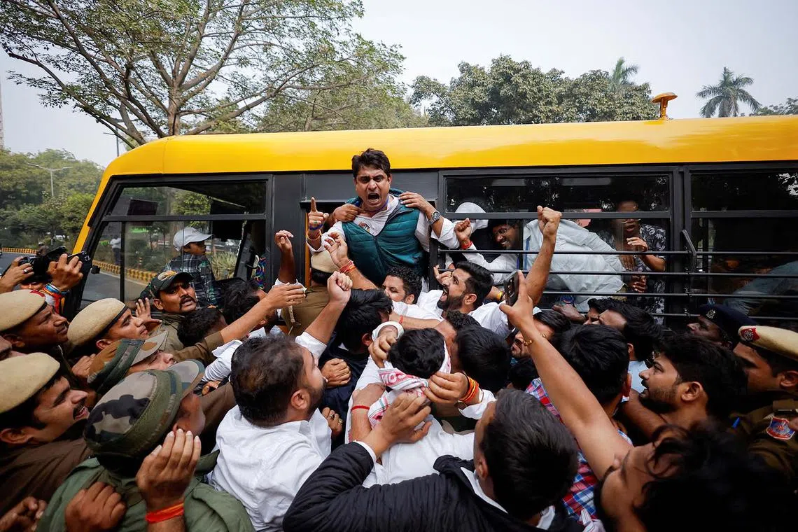 Police detaining supporters of India's main opposition Congress party during a protest against Indian billionaire Gautam Adani, after he was indicted in New York over his role in an alleged multi-billion-dollar bribery and fraud scheme, in New Delhi, India, Nov 25, 2024. 