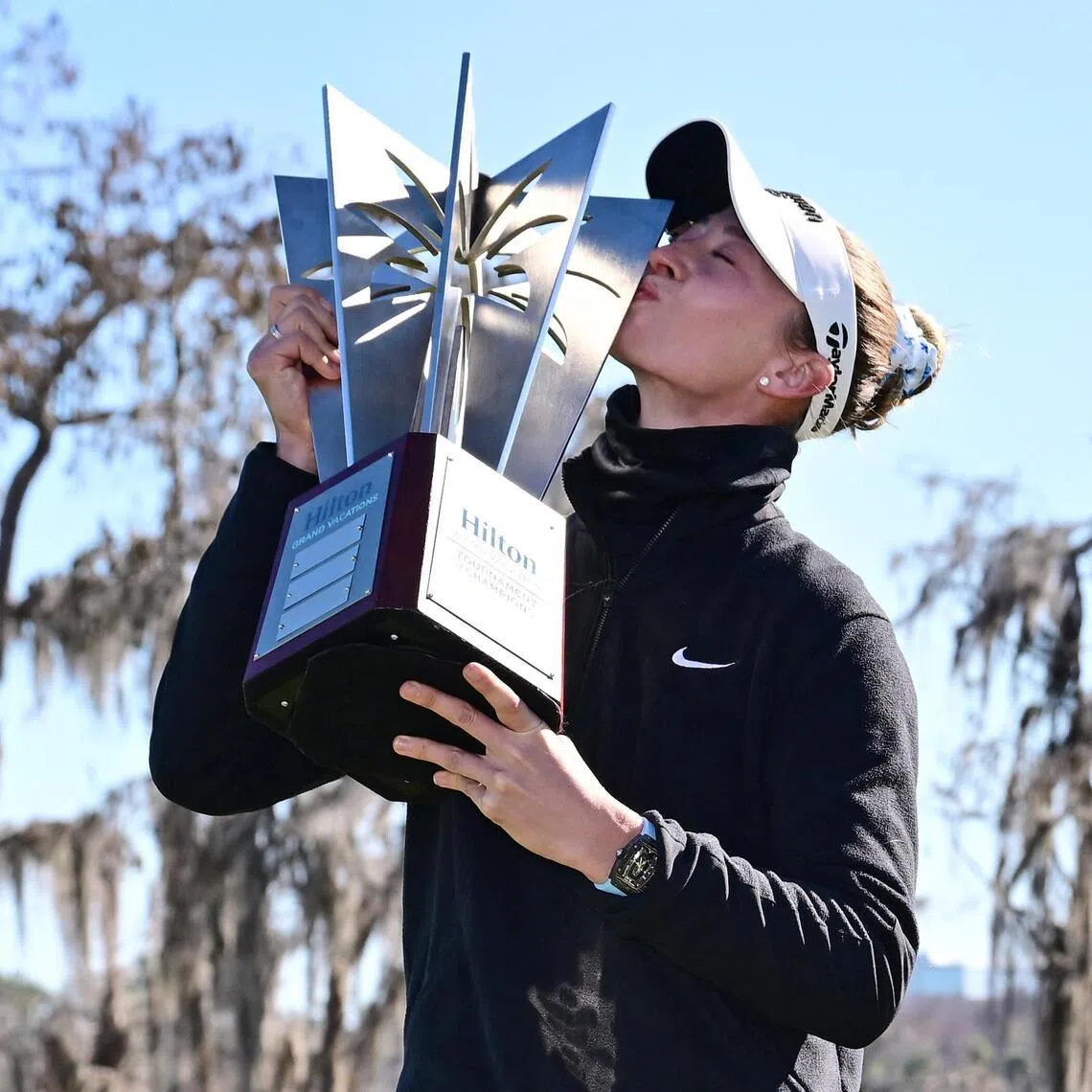 Nelly Korda of the United States poses with the trophy following the completion of the third round of the Tournament of Champions 2026 at Lake Nona Golf & Country Club.