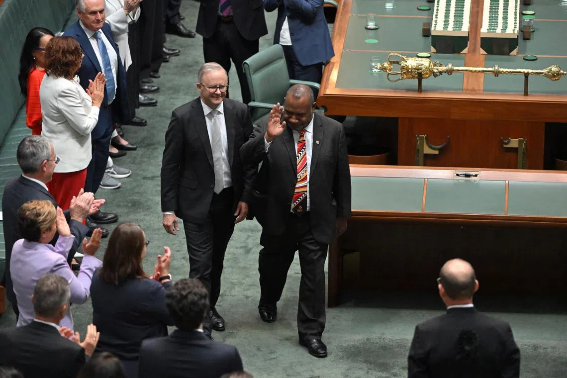 Australian Prime Minister Anthony Albanese escorting his Papua New Guinean counterpart James Marape during a Parliament sitting in Canberra on Feb 8.