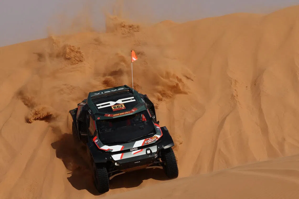 Rallying - Dakar Rally - Stage 6 - Hail to Riyadh - Hail, Saudi Arabia - January 9, 2026 Dacia's Nasser Al-Attiyah and Fabian Lurquin in action during stage 6. REUTERS/Stephane Mahe