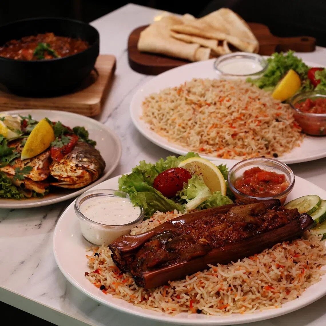 Hadramawt Kitchen, which moved into its new premises at Hotel Boss, has several new dishes including (from front, clockwise) Mandhi Brinjal, Mandhi Fish and Fahsah.