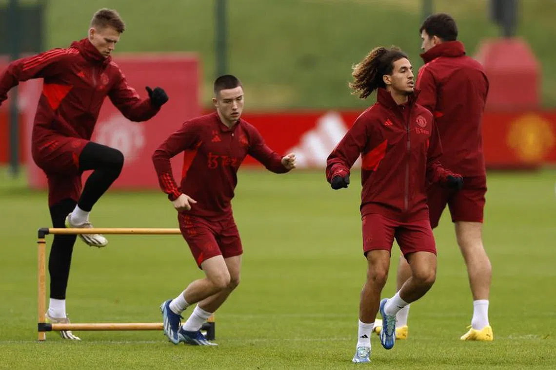 Soccer Football - Champions League - Manchester United Training - Trafford Training Centre, Carrington, Britain - December 11, 2023 Manchester United's Daniel Gore and Hannibal Mejbri during training Action Images via Reuters/Jason Cairnduff