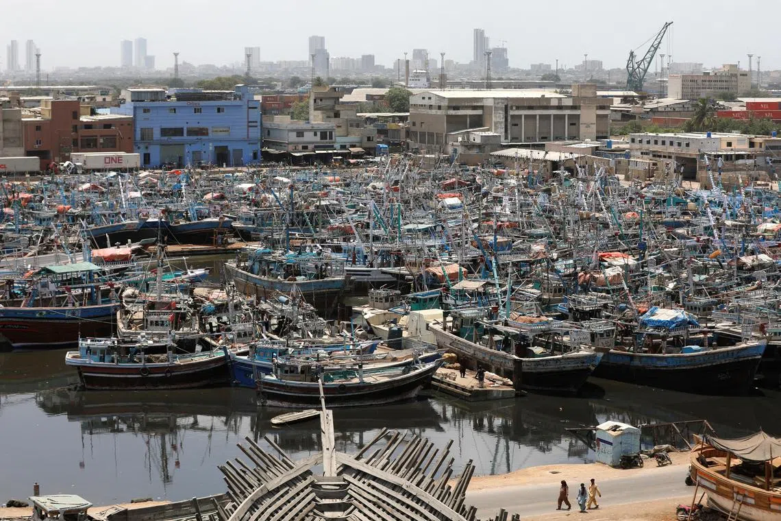 View of anchored fishing boats, after ban imposed on coastal activities following the cyclonic storm, Biparjoy, over the Arabian Sea, at Karachi's Fish Harbour, in Karachi, Pakistan June 10, 2023. REUTERS/Akhtar Soomro REFILE - QUALITY REPEAT