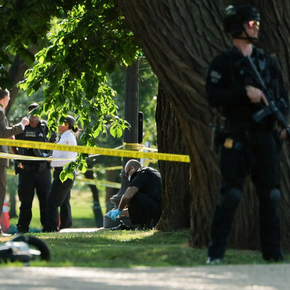 A U.S. Secret Service crime scene investigator works at the scene of an officer-involved shooting in Washington, D.C., U.S., May 4, 2026. REUTERS/Jonathan Ernst
