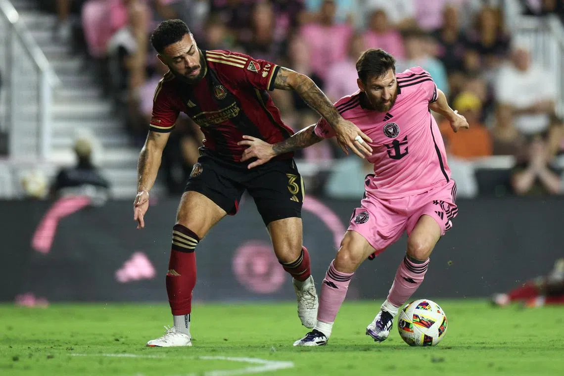 Inter Miami forward Lionel Messi (right) duelling with Atlanta United defender Derrick Williams during Miami's 3-2 MLS Cup loss at Chase Stadium.