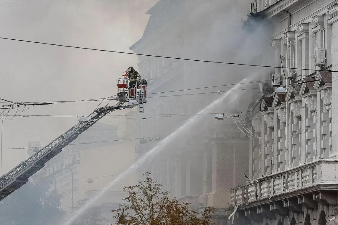 A firefighter working at the headquarters of Ukraine’s SBU security service after a Russian drone strike on Sept 4.