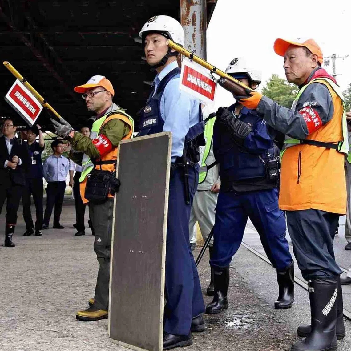 Hunting association members and police officers train to confront bears in an "emergency hunting" program in Tendo, Yamagata Prefecture, on Sept 25.
