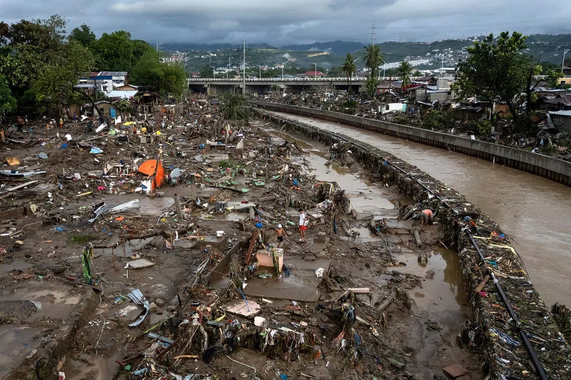 A drone view shows residents returning to the remains of their wrecked homes after heavy flooding caused by Typhoon Kalmaegi in Talisay, Cebu, Philippines, November 5, 2025. REUTERS/Eloisa Lopez