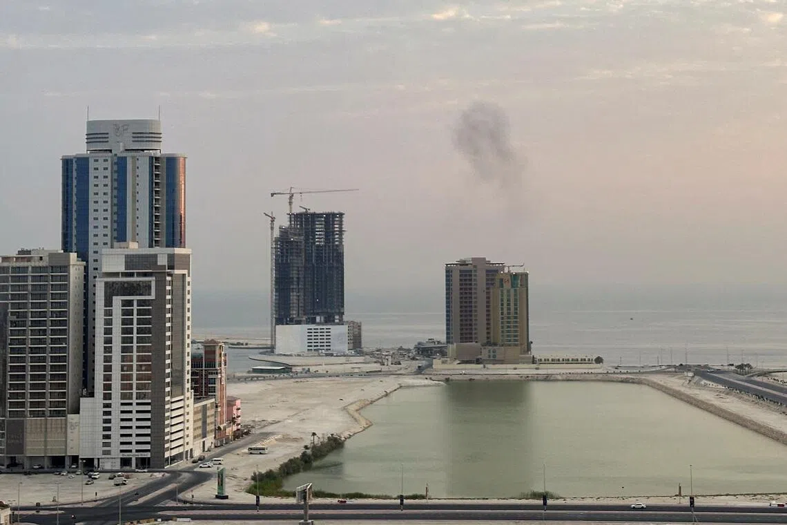 Smoke rises after a drone was intercepted during early morning hours in Manama, Bahrain, on July 14.