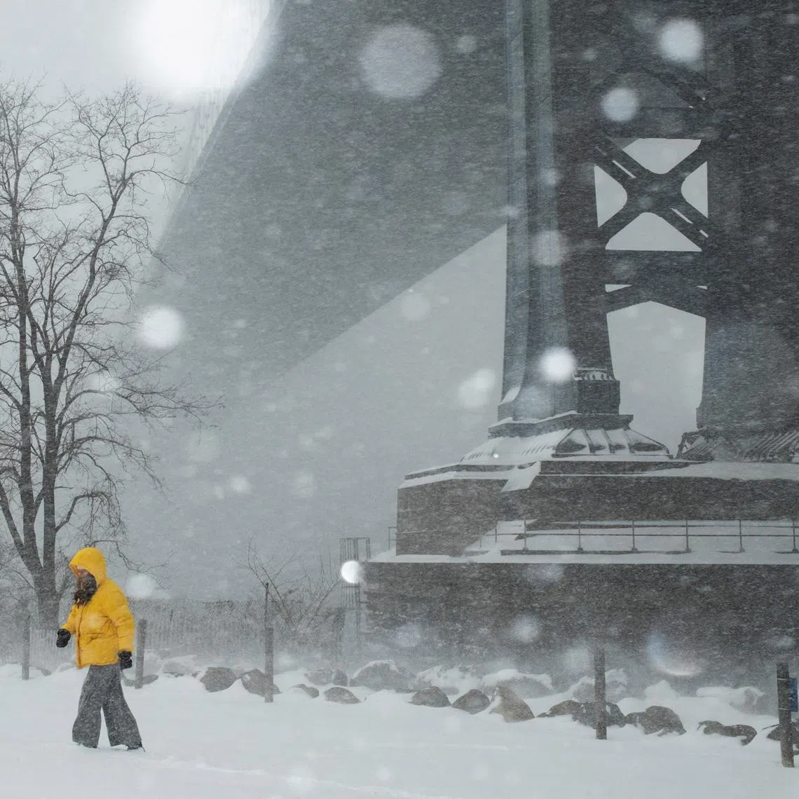 A person walks amid a major winter storm spreading across a large swath of the United States, in Brooklyn, New York City, U.S., January 25, 2026. REUTERS/Amr Alfiky