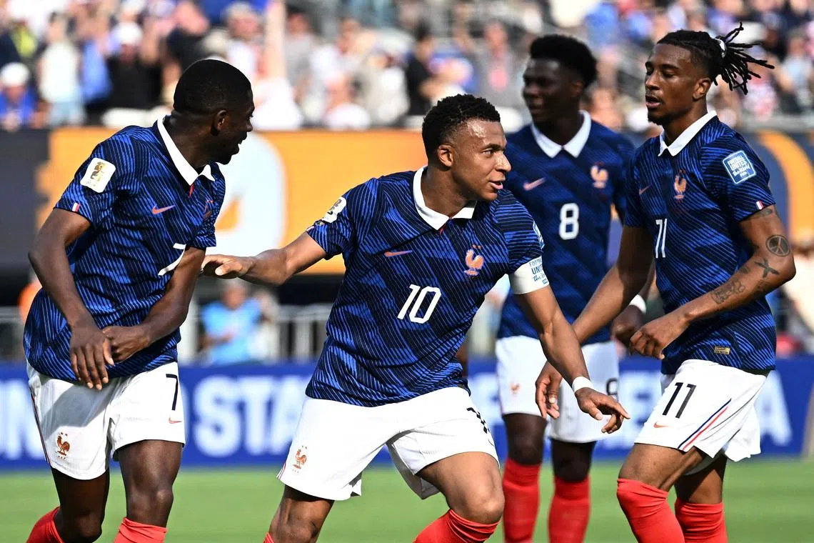 Soccer Football - FIFA World Cup 2026 - Round of 32 - France v Sweden - New York New Jersey Stadium, East Rutherford, New Jersey, U.S. - June 30, 2026 France's Kylian Mbappe celebrates scoring their first goal with Ousmane Dembele and Michael Olise REUTERS/Dylan Martinez