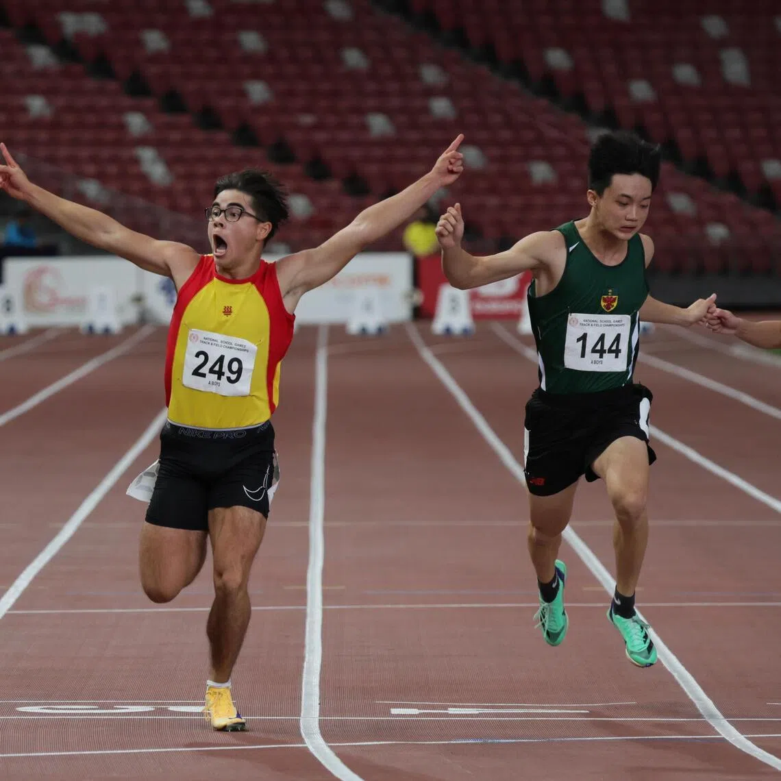 Jonathan Hoare (left), of Hwa Chong Institution, celebrating his win in the A Division boys' 100m final, during the National School Games at the National Stadium on April 15.