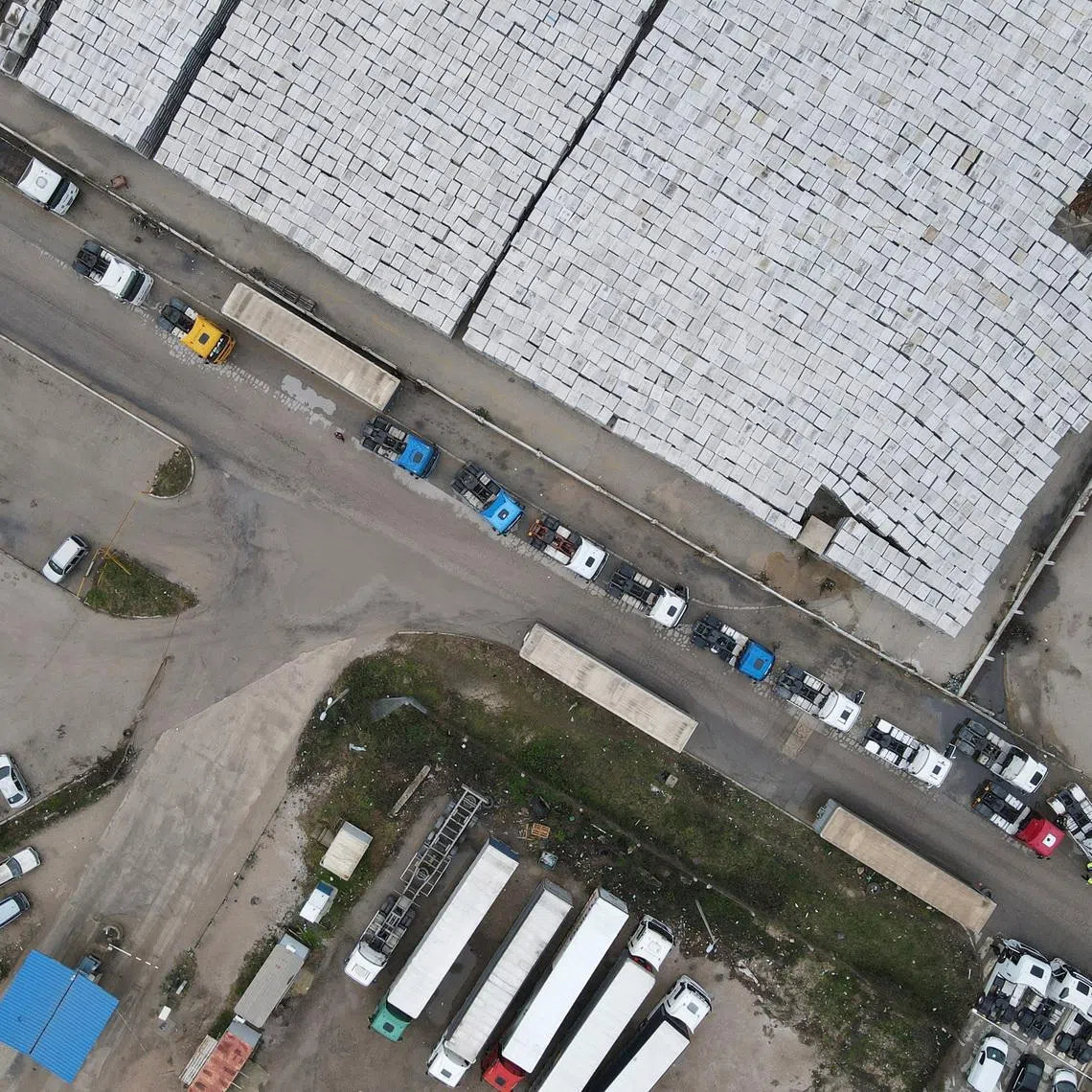 A drone view of truck drivers and transport union representatives protesting in front of the Port of Bar, as part of wider Western Balkans blockades against the EU's new entry–exit rules, with growing concerns over fuel shortages after Montenegro's energy ministry warned supplies were limited to what was available at petrol stations, in Bar, Montenegro, January 29, 2026. REUTERS/Stevo Vasiljevic