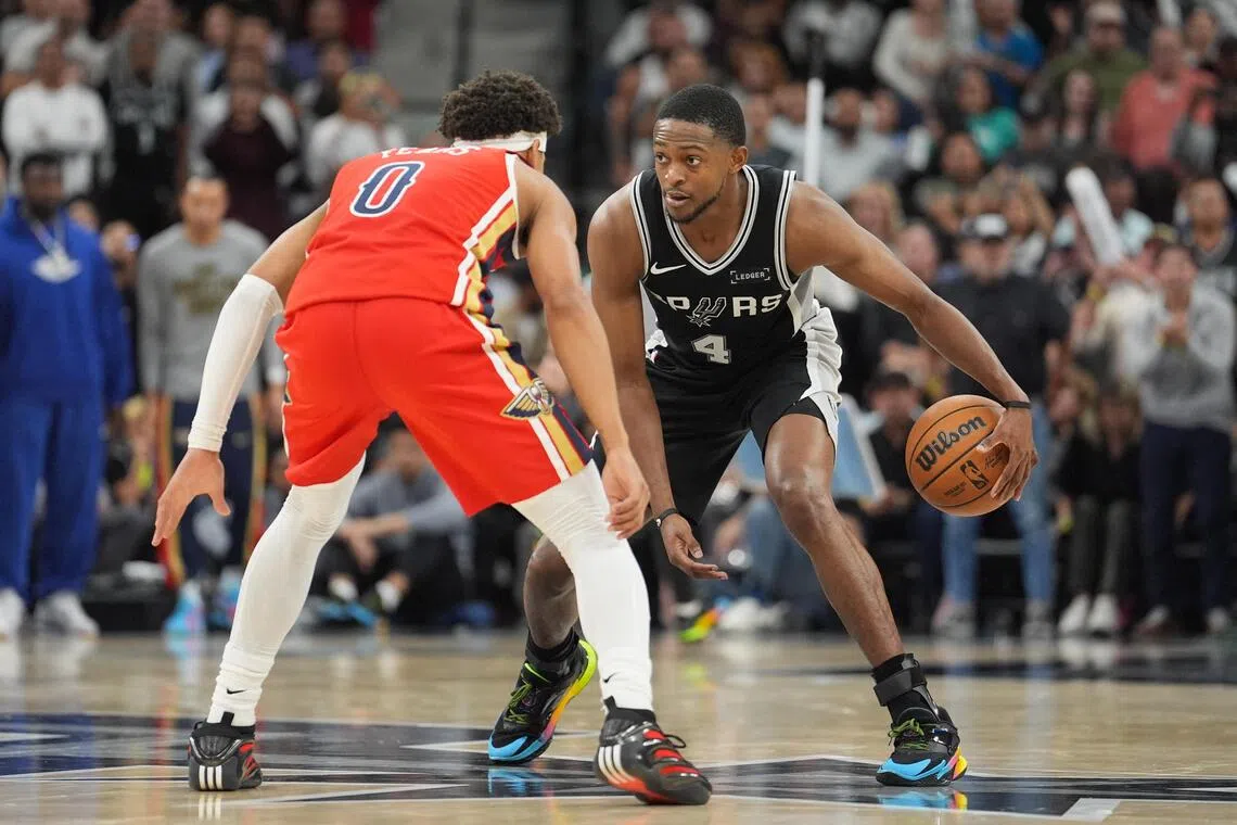 San Antonio Spurs guard De'Aaron Fox dribbling against New Orleans Pelicans guard Jeremiah Fears in the second half of the Spurs' 126-119 NBA win at Frost Bank Centre.