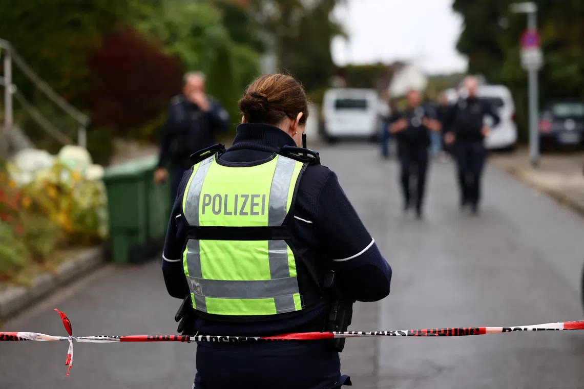 A police officer works at the scene after Herdecke's newly elected Mayor Iris Stalzer was found seriously injured in a stabbing incident, in Herdecke, Germany, October 7, 2025. REUTERS/Leon Kuegeler