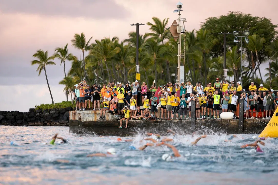 Competitors in the swimming leg of the Ironman World Championship women's race in Kailua-Kona, Hawaii, on Oct 6, 2022.