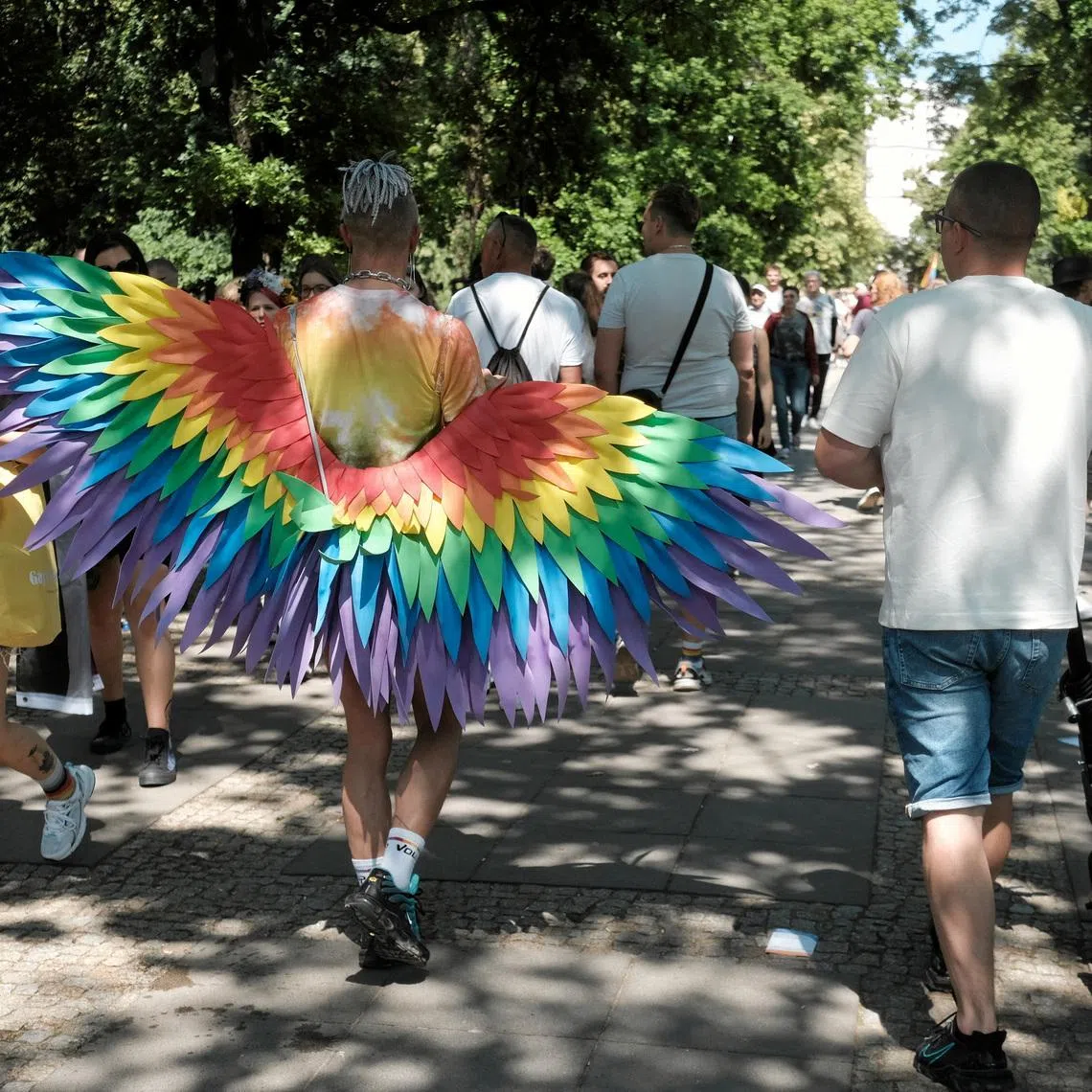 A person wears rainbow colored wings during the LGBT+ pride parade, known as the \"Equality March\" under the theme \"The Answer is Love\", in Warsaw, Poland June 14, 2025. Slawomir Kaminski/ Agencja Wyborcza.pl/via REUTERS