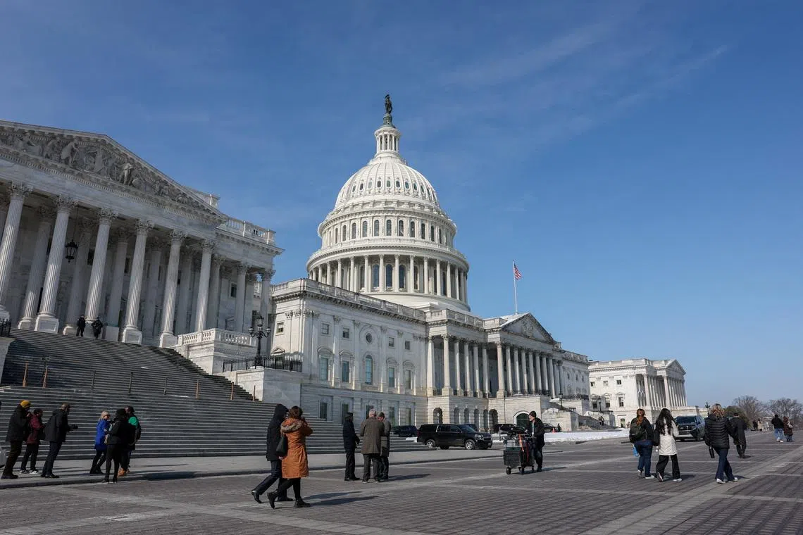 People walk near the U.S. Capitol building in Washington, D.C., U.S., February 4, 2026. REUTERS/Kylie Cooper
