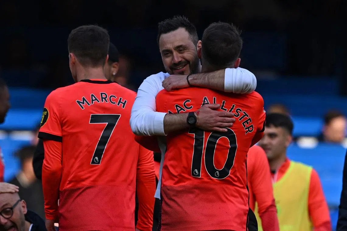 Brighton manager Roberto de Zerbi hugging midfielder Alexis Mac Allister after their 2-1 win over Chelsea.