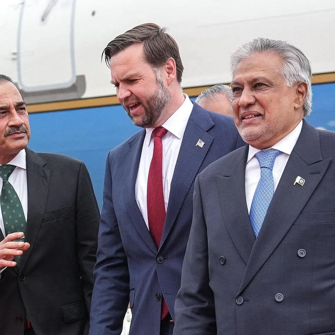 US Vice President JD Vance (centre) speaks with Army Chief Syed Asim Munir (left) and Pakistan's Foreign Minister Ishaq Dar after arriving for the US-Iran peace talks in Islamabad on April 11.
