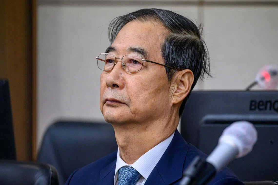 Former prime minister Han Duck-soo attends the first hearing of his trial on Sept 30, 2025.
