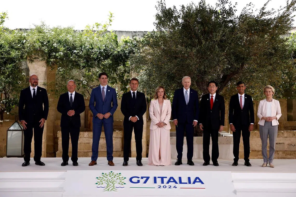 Italy's Prime Minister Giorgia Meloni, U.S. President Joe Biden, France's President Emmanuel Macron, Canada's Prime Minister Justin Trudeau, Germany's Chancellor Olaf Scholz, Britain's Prime Minister Rishi Sunak, Japan's Prime Minister Fumio Kishida, European Commission President Ursula von der Leyen and President of the European Council Charles Michel pose for a family photo on the first day of the G7 summit at the Borgo Egnazia resort, in Savelletri, Italy June 13, 2024. REUTERS/Guglielmo Mangiapane