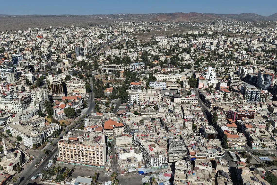 A drone view shows the predominantly Druze city of Sweida, following deadly clashes between Druze fighters, Sunni Bedouin tribes and government forces, in Syria July 25, 2025. REUTERS/Khalil Ashawi/File Photo